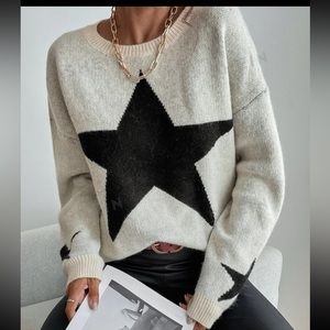 A3 - 173 ⭐️ Black and white star pattern sweater size medium 🌟